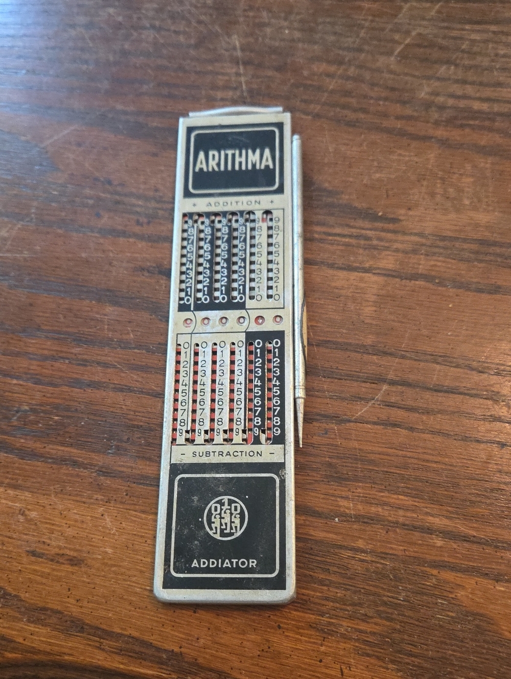 Arithma Addiator Vintage Mechanical Calculator in Silver and Black